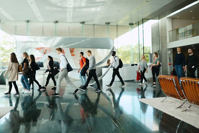 Postgraduates working around table