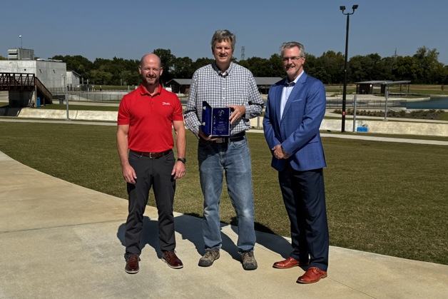 Jon Harwood, regional sales manager at Danfoss Drives (left) and Joseph Halliday, sales director at Danfoss Drives (right) present Jacob Clawson, business development manager at Cloward H2O with the EnVisioneer of the Year award in the Consultant category.