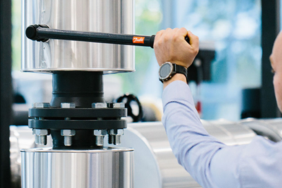 Man working with Danfoss heating system