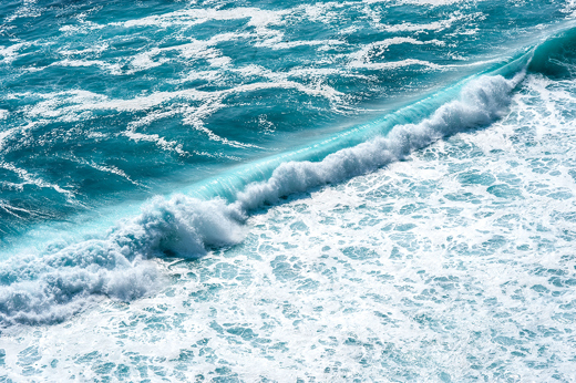 Beach waves breaking on the shore