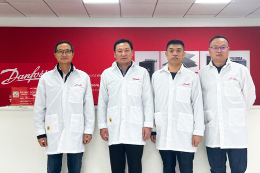 4 engineers at a Danfoss office in China