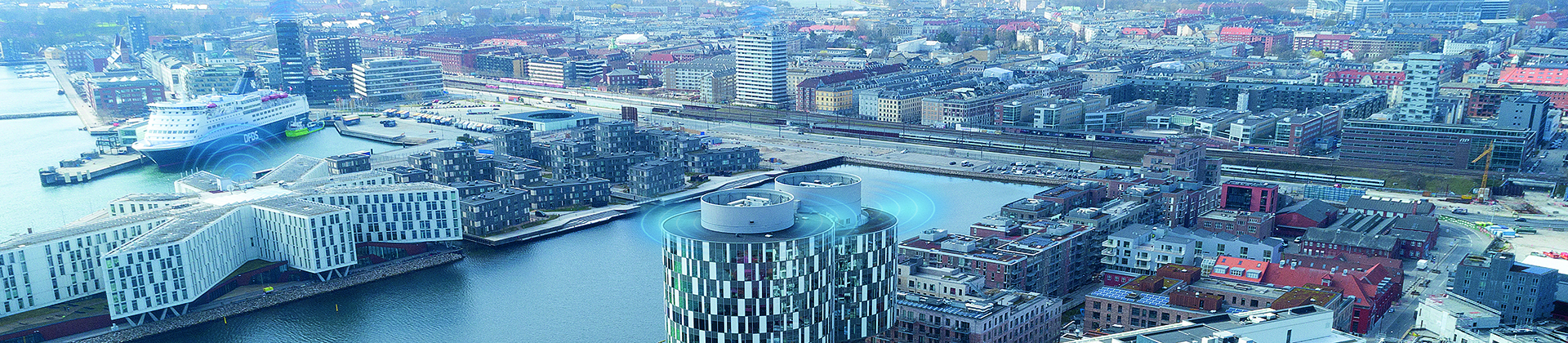 Vista aérea de Nordhavn, Copenhague, en la que se muestra una señal de monitorización basada en condiciones en la parte superior de varios edificios