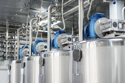 Four electric motors with blue lines around them indicating condition monitoring sensors