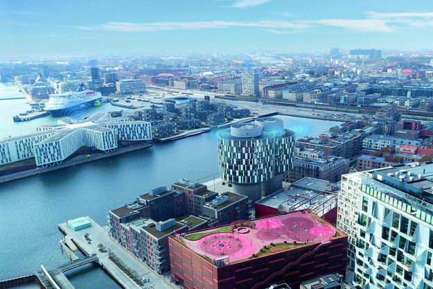 Aerial view of Nordhavn in Copenhagen, with a condition-based monitoring signal showing on top of several buildings